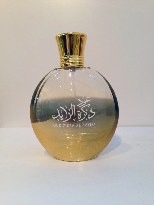 gold color perfume bottle with metal cap/lid