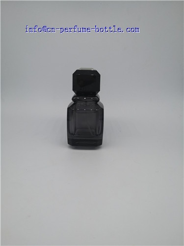 black perfume bottle in glass cap