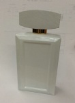 white perfume bottle with white wooden cap
